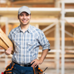 Portrait of a smiling carpenter in construction site